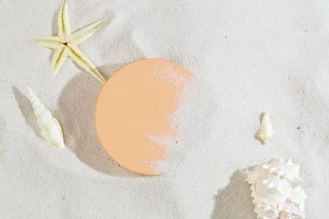 The white sand background is highlighted with a round platform, starfish an.. 写真素材