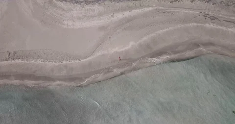 White Sand Beach Greece Man Walking Down Drone Shot Stock Footage 106341285