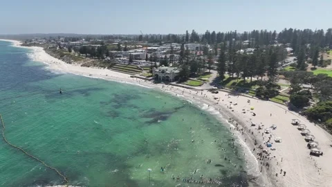White sand beach huts with shark net Cottesloe Perth Australia 4k Stock Footage 265877199