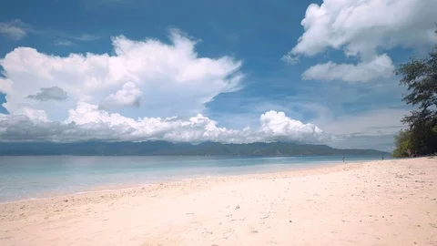 White sand beach with mountains background on Gili Meno, Indonesia Stock Footage 78527382