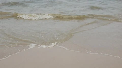 White sand beach while sea wave hit the surface on sandy beach in sunny sun.. Stock Footage 301200681