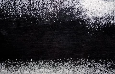White sand on a black background, texture Stock Photos