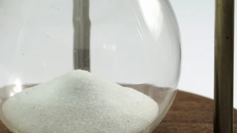 White sand flowing in the hourglass Stock Footage 100693063
