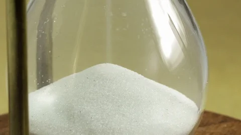 White sand flowing in the hourglass Stock Footage 100693868