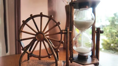 White sand flows through an hourglass 動画素材 276823591
