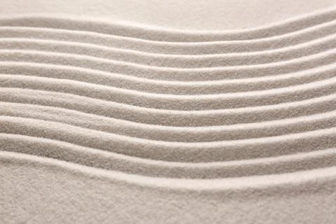 White sand with pattern as background, closeup. Concept of zen and harmony Stock Photos