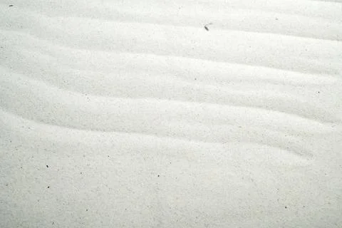 White sand texture with elegant ripple patterns, perfect for zen, relaxatio.. Stock Photos