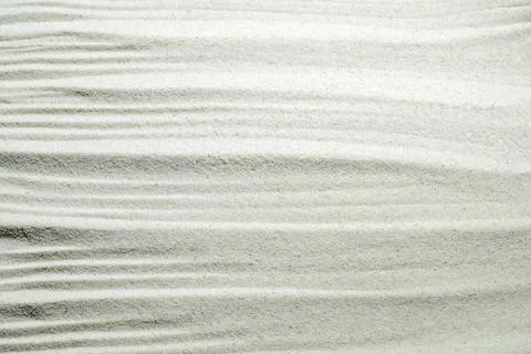 White sand texture with elegant ripple patterns, perfect for zen, relaxatio.. Stock Photos
