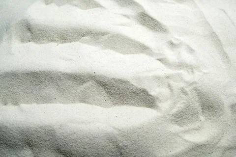 White sand texture with elegant ripple patterns, perfect for zen, relaxatio.. Stock Photos