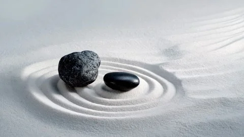White sand with two elegant black stones in a Zen garden Video stock 315960614