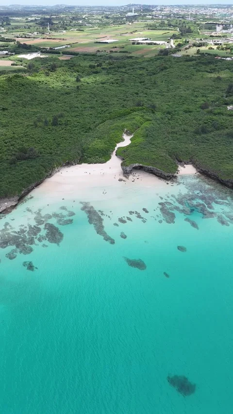 White Sands &amp; Emerald Sea – Vertical Drone at Sunayama Beach Stock Footage 309509653