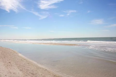 White sandy beach and blue sky Stock Photos