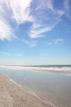 White sandy beach and blue sky Stock Photos