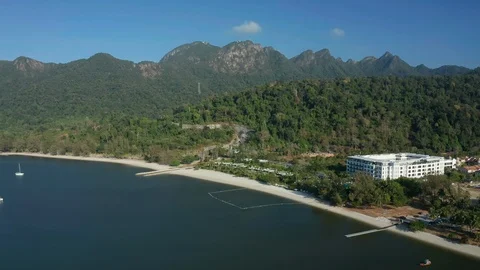 White sandy beach and crystal clear blue water of Pantai Kok, Langkawi island Stock Footage 124483254