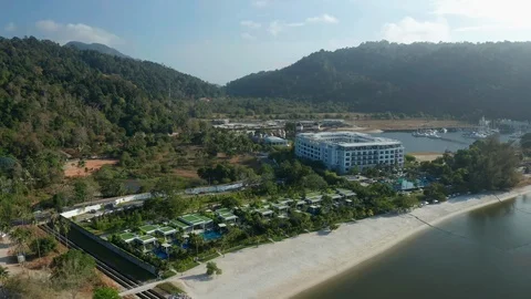 White sandy beach and crystal clear blue water of Pantai Kok, Langkawi island Stock Footage 124484088
