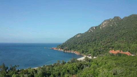 White sandy beach and crystal clear blue water of Pantai Kok, Langkawi island Stock Footage 124486669