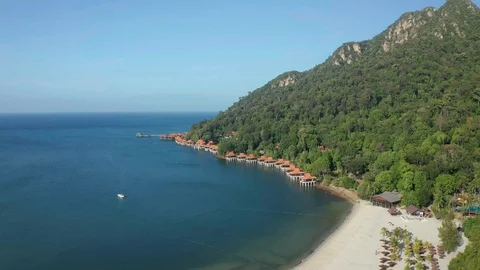 White sandy beach and crystal clear blue water of Pantai Kok, Langkawi island Stock Footage 124488722