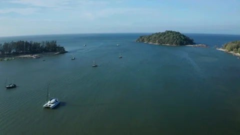 White sandy beach and crystal clear blue water of Pantai Kok, Langkawi island Stock Footage 124490105