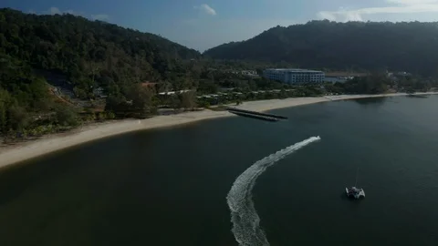 White sandy beach and crystal clear blue water of Pantai Kok, Langkawi island Stock Footage 124505907