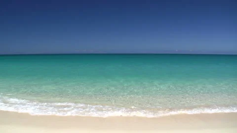 White Sandy Beach and Emerald Green Sea: Nagama Beach Stock Footage 327516694