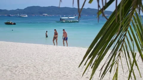 The white sandy beach and the rides and features have made Boracay, Philippines Vídeo Stock 345121810