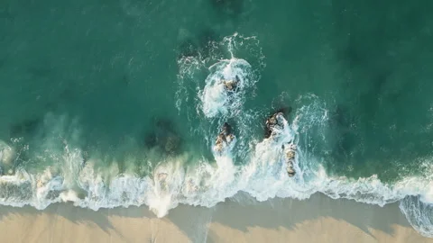 White sandy beach with clear azure water aerial top down view Stock Footage 245441683