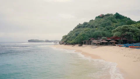 White sandy beach with straw umbrellas Stock Footage 93600065