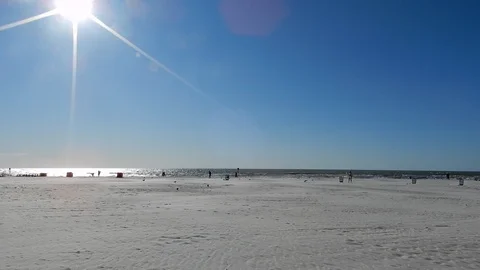 White Sandy Beach Wide Angle View Left To Right Pan With Sun Flares Bokeh Stock Footage 127186147