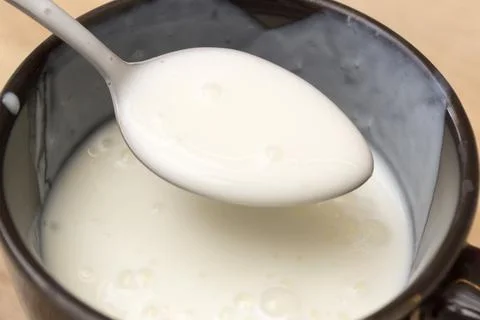 White sauce in a spoon Stock Photos