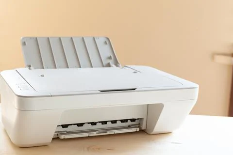 White scanner or printer machine on a table close up Stock Photos