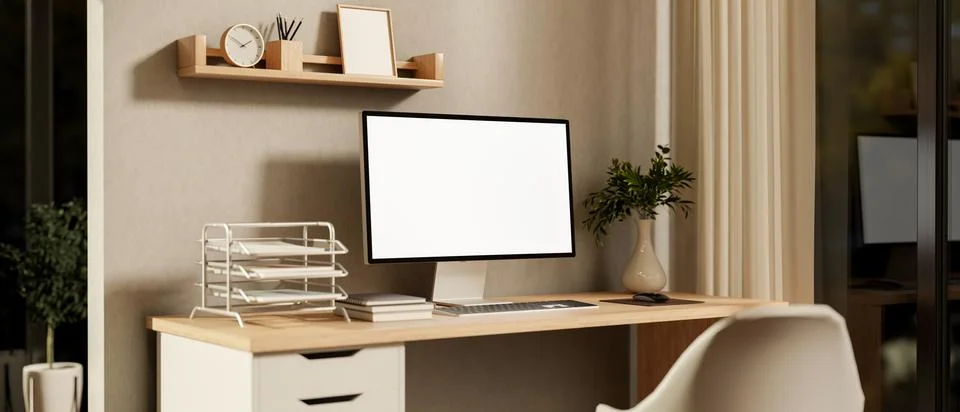 White screen computer and book on wooden drawer table and chair in glass wa.. イラスト素材