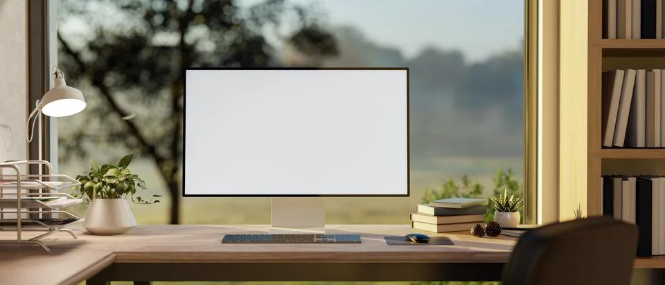 A white screen computer and lamp on wooden table under a glass window with .. Stock Illustration