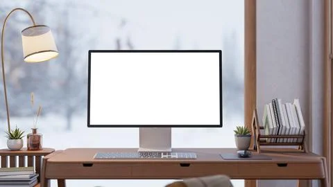 White screen computer with book rack on wooden table aside lamp and snowfal.. イラスト素材