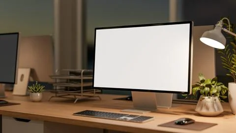 White screen computer with potted plant and desk lamp on wooden working tab.. Stock Illustration