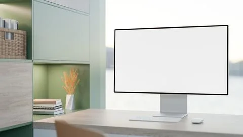 White screen computer on wooden counter table aside green cabinet bookshelf.. Illustrazione stock