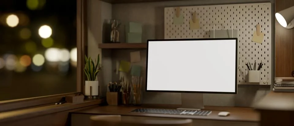 A white screen computer on wooden table under lamp light with street view f.. Stock Illustration