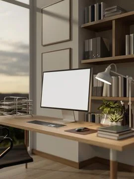 White screen computer on wooden table with books, potted plant and lamp in .. 스톡 일러스트
