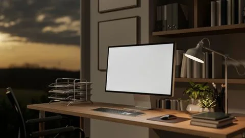 White screen computer on wooden table with books and potted plants under la.. 스톡 일러스트