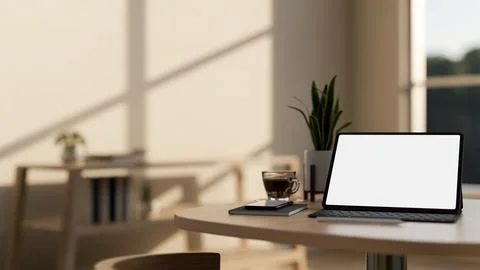 A white-screen digital tablet mockup and decor on a wooden table in a cozy .. Illustrazione stock