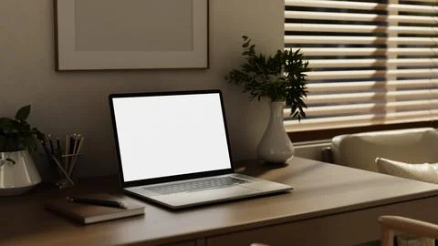 White screen laptop and notebook beside potted plant on wooden desk table i.. Stock Illustration