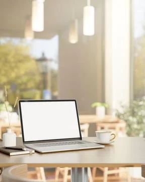 White screen laptop with book and coffee on wooden table and chairs in a ca.. 스톡 일러스트