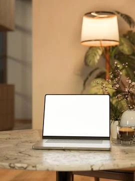 White screen laptop with coffee cup aside vase on round marble table across.. イラスト素材