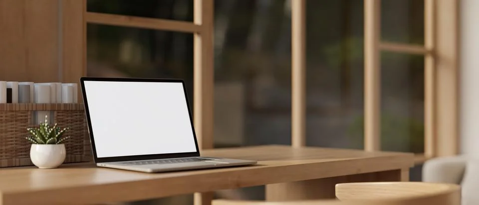 A white-screen laptop computer mockup on a wooden desk in a modern, Scandin.. Stock Illustration