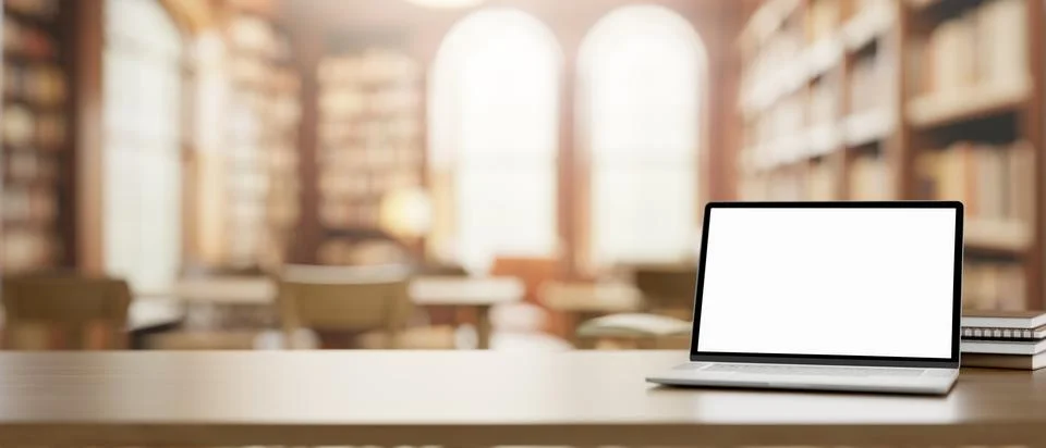 A white-screen laptop computer mockup and books on a wooden table in a beau.. Stock Illustration