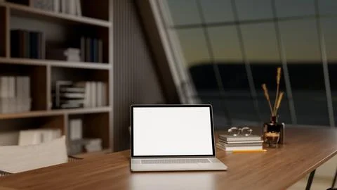 White screen laptop with glass of coffee and book on wooden table in dim li.. イラスト素材