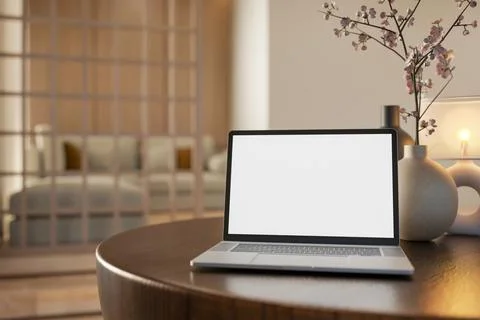 White screen laptop with lamp and vase on round wooden table across partiti.. Stock Illustration