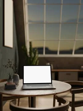 White screen laptop on round table with books and vase and wooden chairs ac.. Stock Illustration