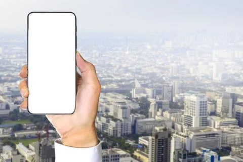 White screen mobile phone model for inserting images or text on a big city .. Stock Photos