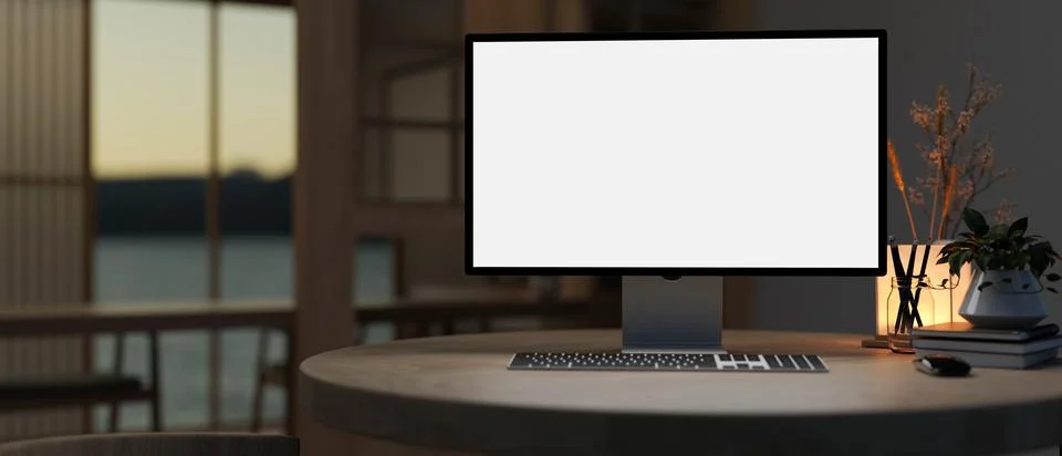 A white-screen PC computer and accessories on a table in a modern dark room. Stock Illustration