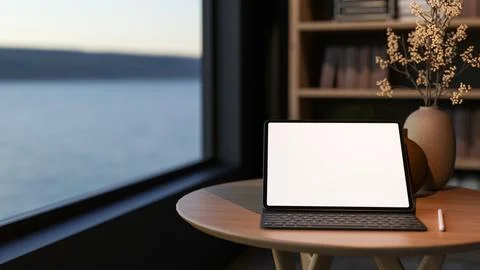 White screen tablet with keyboard and stylus on round wooden table aside bo.. Stock Illustration